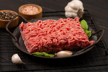 Raw homemade minced meat on a tin plate