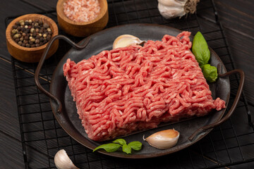 Raw homemade minced meat on a tin plate