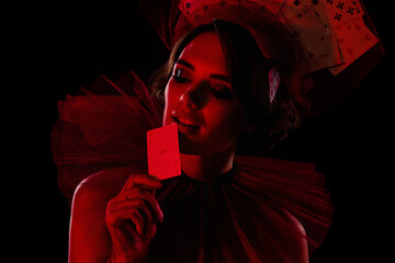 Closeup photo poker player lady wear casino night theme costume dress play poker bluffing eyes hold red ace combination