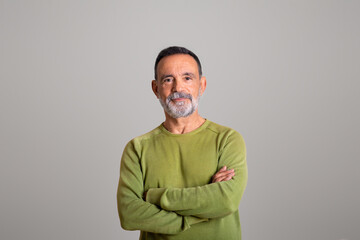 Happy confident old european man with crossed arms on chest look at camera isolated