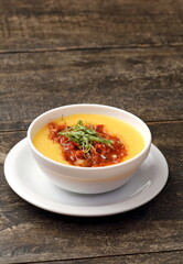 Polenta with sausage ragout in bowl