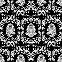 Fototapeta premium Seamless from leaves and flowers on black background (can be repeated and scaled in any size)