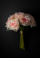 bouquet of white roses on a black background