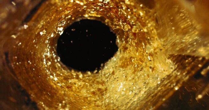 Super Slow Motion Shot of Golden Alcohol Liquid