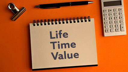 There is notebook with the word Life Time Value. It is as an eye-catching image. - obrazy, fototapety, plakaty
