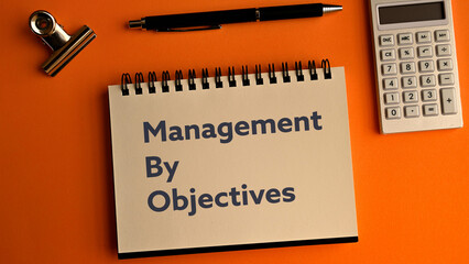 There is notebook with the word Management by Objectives. It is as an eye-catching image.