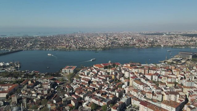 Aerial view of Beyoglu district along the Golden Horn river estuary with Galata bridge and the Ataturk bridge connecting Istanbul European Side, Turkey.
