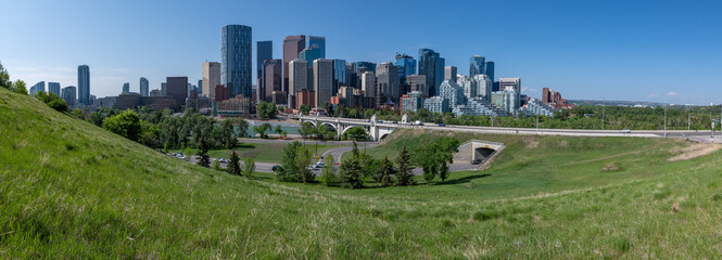 Panoramic city skyline in Calgary, Alberta during summer time with beautiful blue sky day Centre St...
