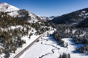 Fototapeta na wymiar Winding Through Winter's Grace: A Snowy Serenade in Utah's Cottonwood Valley