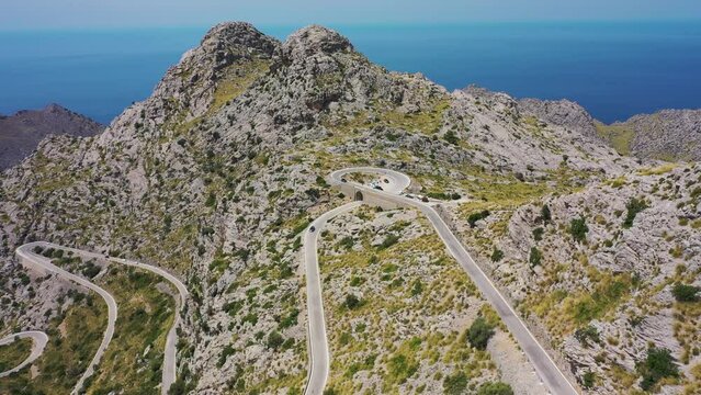 Aerial view of a serpentine road across the mountains at Sa Calobra, Mallorca, Spain.