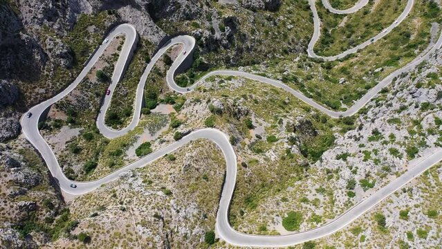 Aerial view of a serpentine road across the mountains at Sa Calobra, Mallorca, Spain.