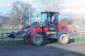 Fototapeta premium Red tractor on animal farm.High quality photo.