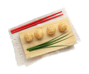 Delicious sesame balls, green leaves and chopsticks on white background, top view