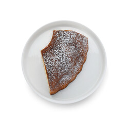 Piece of homemade yogurt cake with powdered sugar on white background, top view