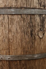 Fototapeta premium Traditional wooden barrel as background, closeup. Wine making