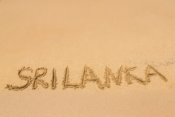 Sri Lanka written in a sandy