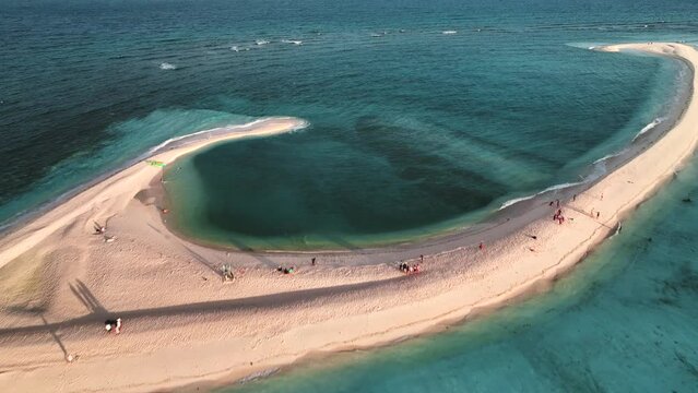 Aerial view of people on White Island along Camiguin Island coastline, Philippines.