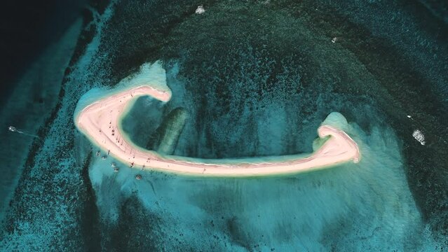 Aerial view of people on White Island along Camiguin Island coastline, Philippines.