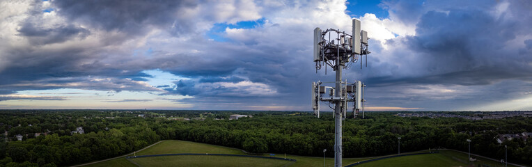 Drone view of telecommunication equipment on top of tall repeater tower located on the outskirts of...