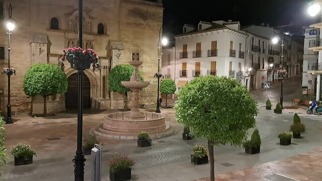 Night Time-lapse of Saint Sebastian Plaza and Parish Church at night. Antequera, Malaga, Andalusia, Spain.