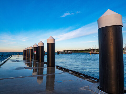 Wave attenuators to reduce or eliminate powerful, natural and incidental waves at Geelong waterfront harbour precinct in Corio Bay in Australia.
