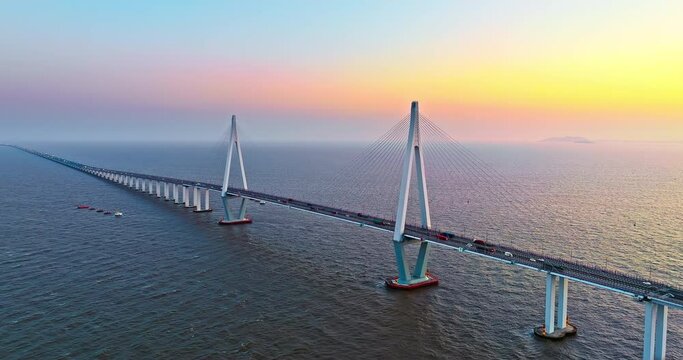 Aerial view of Hangzhou Bay Bridge scenery at sunset, Zhejiang Province, China. The total length of the bridge is 36 kilometers. The design speed is 100 kilometers per hour. 