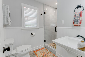 Modern Apartment Bathroom Interior with Standing Glass Shower and Pedestal Sink