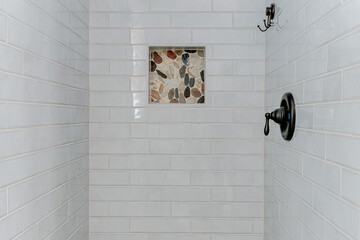Modern Detail of Shower Tiles and Pebble Design