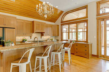 Interior of Staged Clean Modern Kitchen with Luxury Chandelier