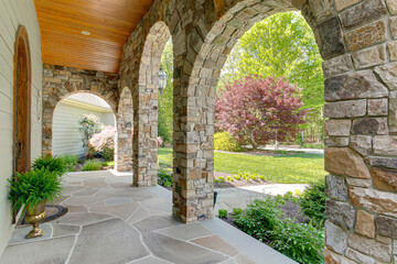 Fototapeta na wymiar Southern Country Front Porch with Stone Arch Entry