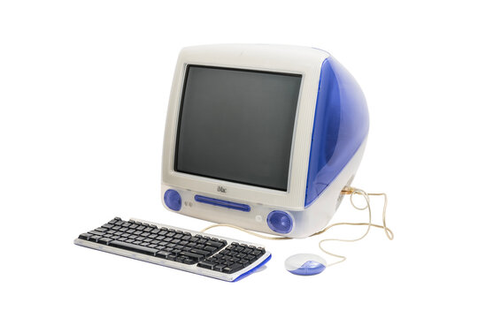 Los Angeles, California, USA - May 29, 2023:  Illustrative editorial photograph of vintage Apple iMac G3 desktop computer with keyboard.  Computer was made in 1999.  Isolated with cut out background.