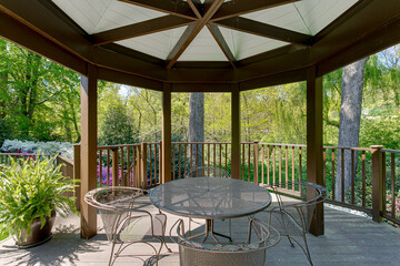 Outdoor Gazebo in the Summer with Patio Set in Nature