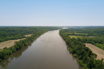 Fototapeta na wymiar Drone Aerial of River in Nature with Fields and Blue Sky
