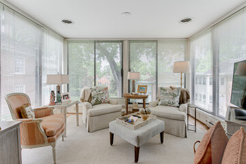 Clean Natural Light in Sunroom with Staged Furniture