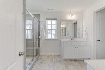 Fototapeta na wymiar Modern Spring Primary Bathroom with Subway Tile Backsplash and White Double Vanity