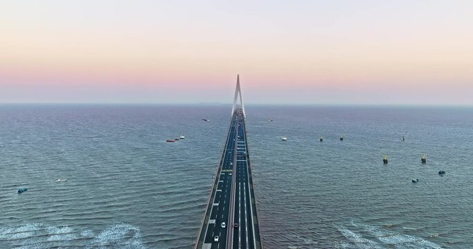 Aerial view of Hangzhou Bay Bridge scenery at sunset, Zhejiang Province, China. The total length of the bridge is 36 kilometers. The design speed is 100 kilometers per hour.
