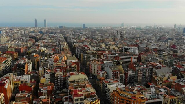 Drone footage flying ofer the buildings in Barcelona, Spain.