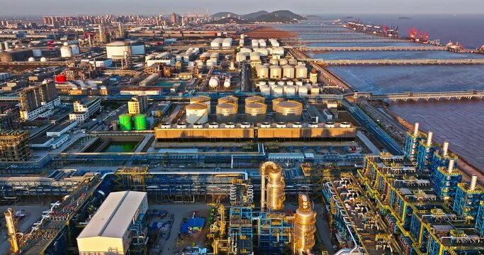 Aerial view of oil and gas petrochemical industrial with Refinery factory. Industrial zone building on the seaside.