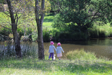 Fototapeta premium Children in the park with a duck
