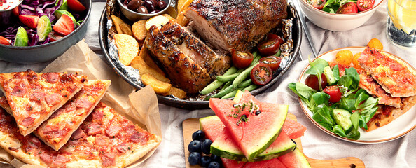 Family dinner or lunch. Many dishes on the table. Top view, copy space