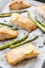 Baked Delicious salmon, green asparagus and lemon in pan