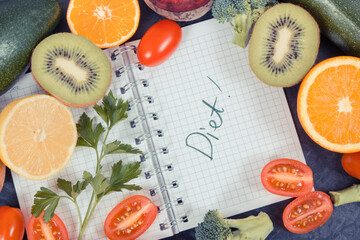 Notepad and fruits with vegetables containing vitamins and minerals, slimming and diet concept. Vintage photo
