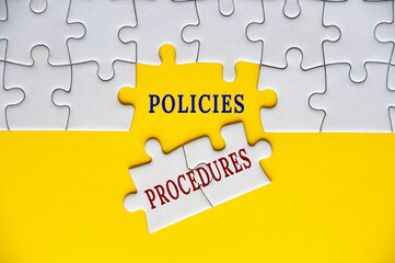 Policies and procedures text on missing jigsaw puzzle. Business policies concept