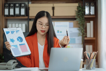 Fototapeta premium Businesswoman analysis graph company financial in office.