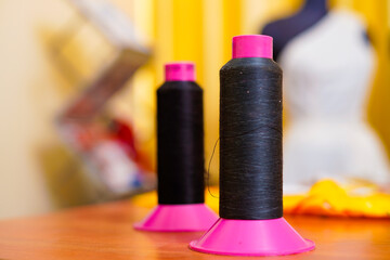 Colorful thread spool on the desk