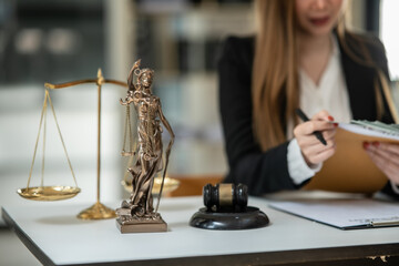 Lawyers Asiawoman   having through online Concepts  of Legal services at the law office.