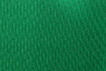 Green color sports clothing fabric football shirt jersey texture and textile background.