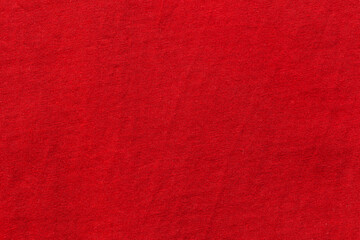 Red color sports clothing fabric football shirt jersey texture and textile background.