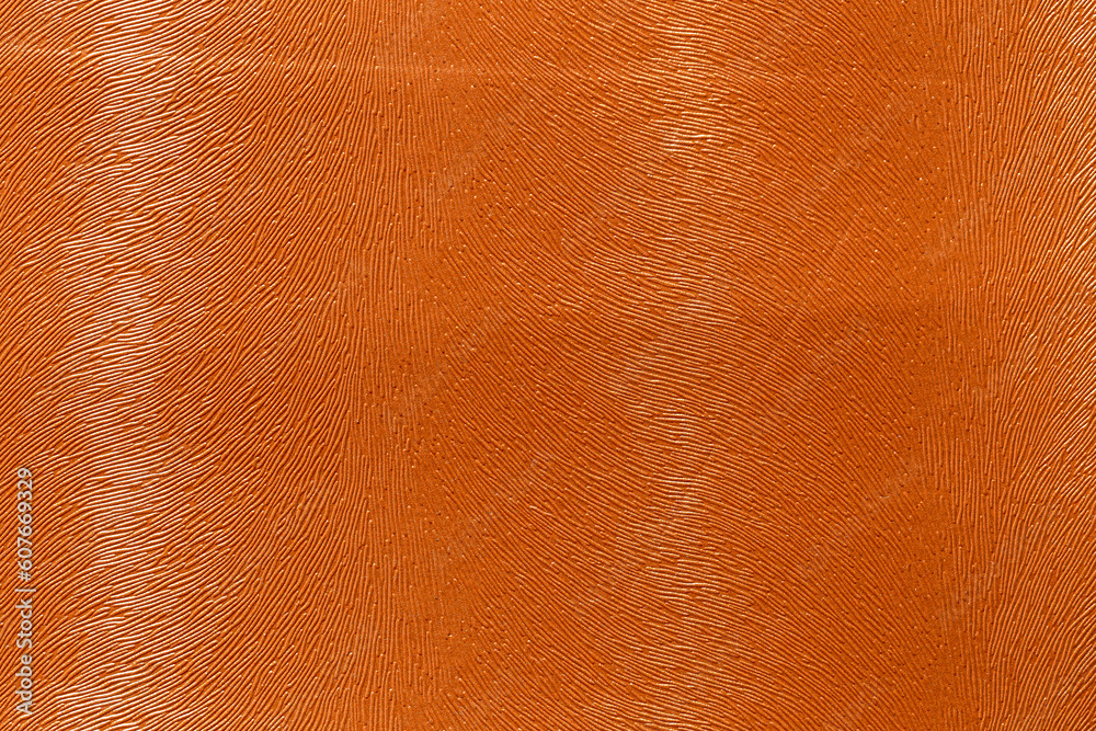 Wall mural orange leather and a textured background.