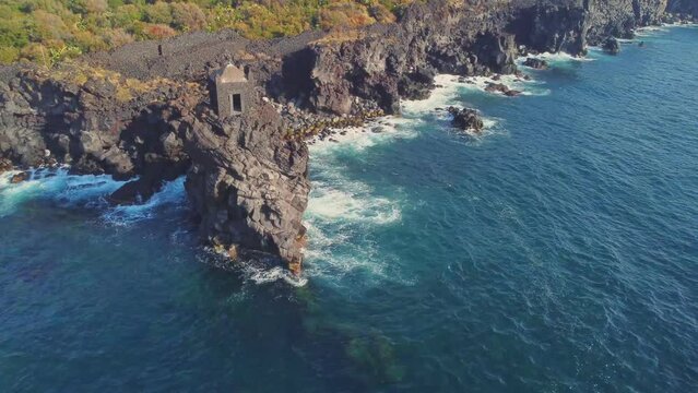 Torre Saracena old tower, Santa Tecla, Catania, Sicily. Sea and rocks